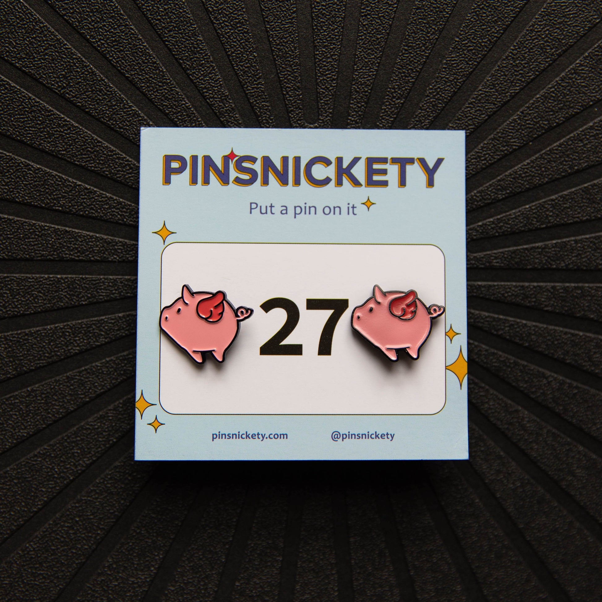 Pinsnickety Flying Pig horse show number pins on their product packaging card