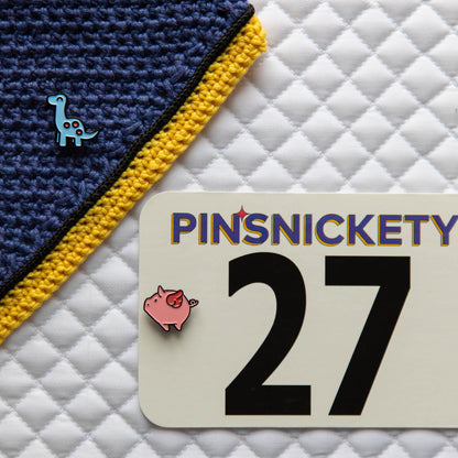 Pinsnickety Brontosaurus pin paired with our Flying Pig pin.