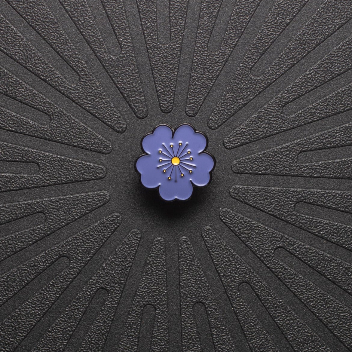 pinsnickety purple poppy horse show number pin on a black background