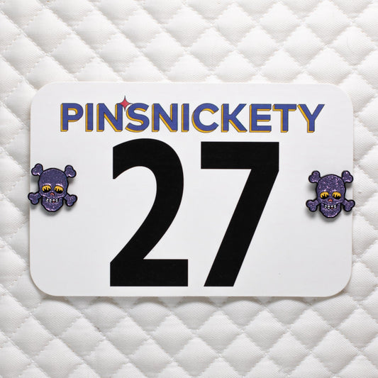 Pinsnickety skull horse show number pins on a saddle pad