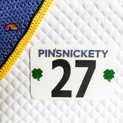 pinsnickety rainbow and clover pins on a bonnet and saddle pad. lucky charms.