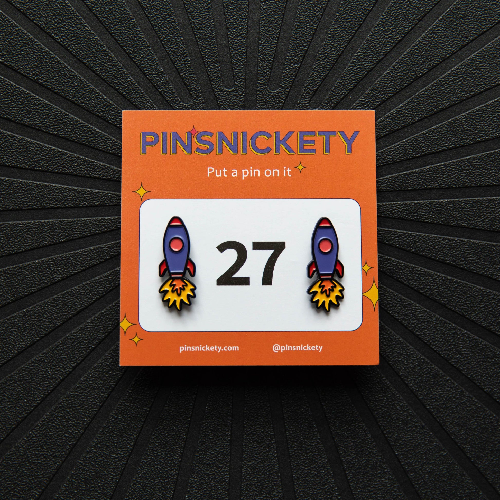 Pinsnickety Rocket Ship horse show number pins with their product packaging card