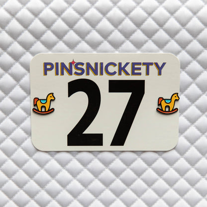 Pinsnickety Rocking Horse horse show number pins on a saddle pad